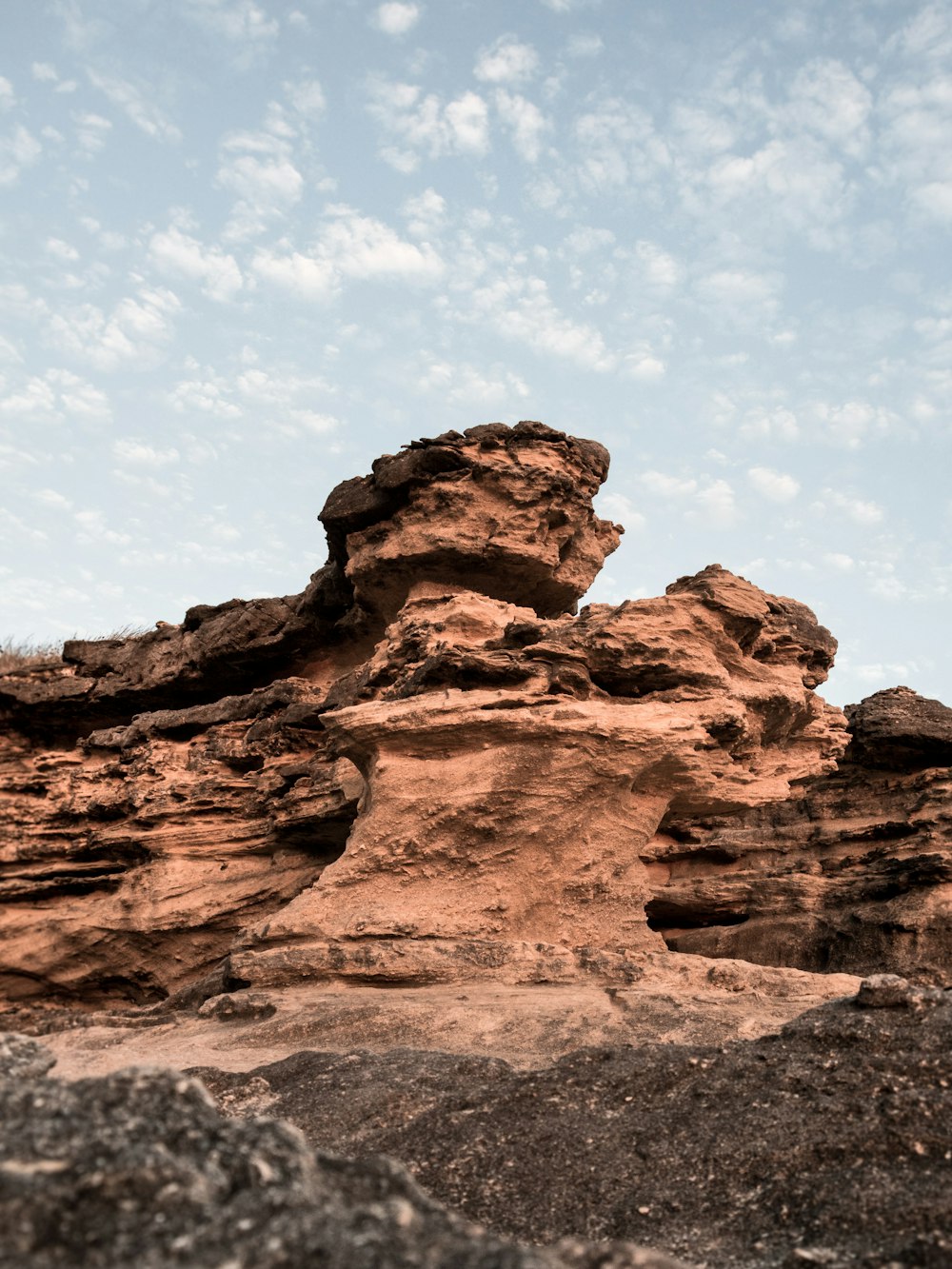 brown rock formation under blue sky during daytime