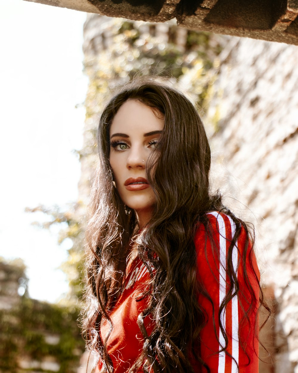 woman in red and black jacket