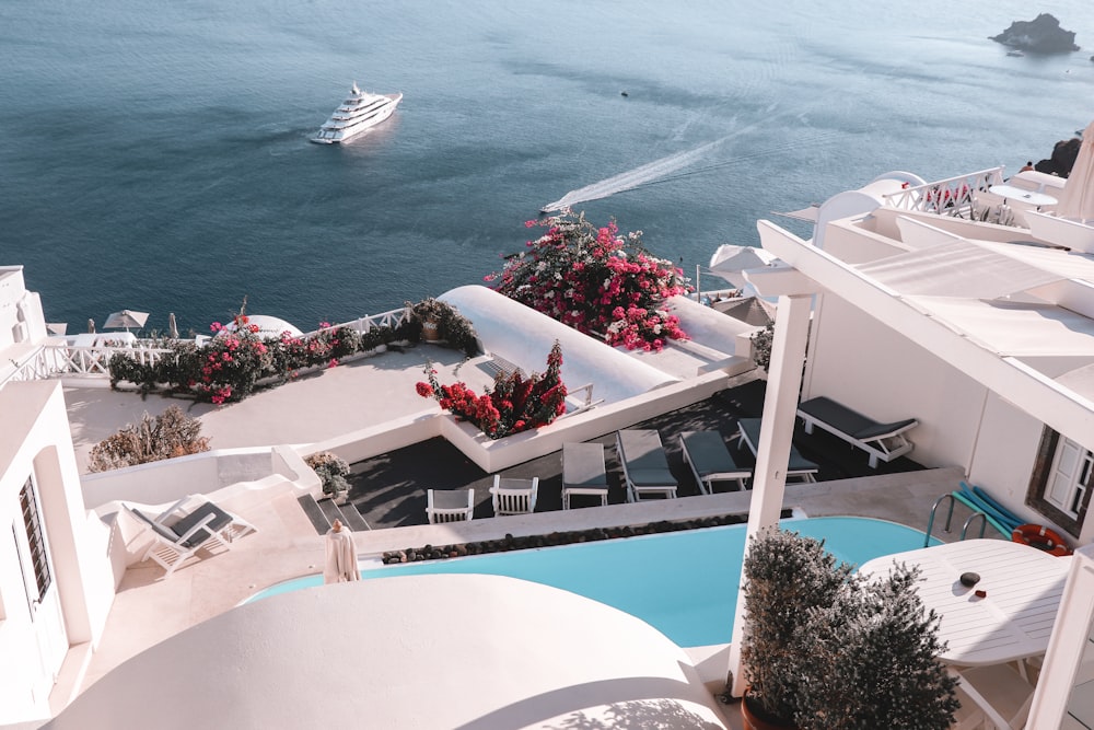 white yacht on body of water during daytime