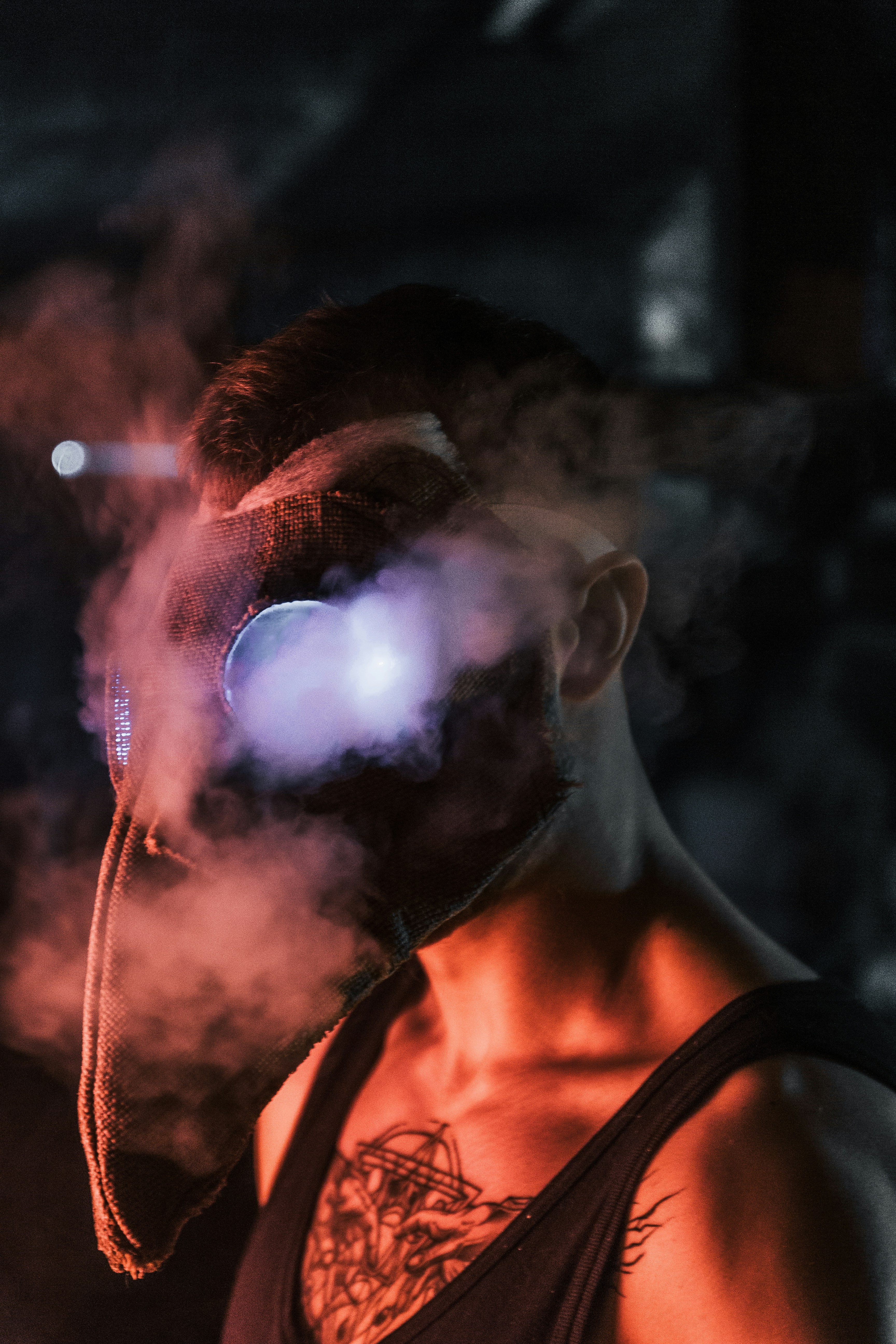 man in black and red shirt smoking
