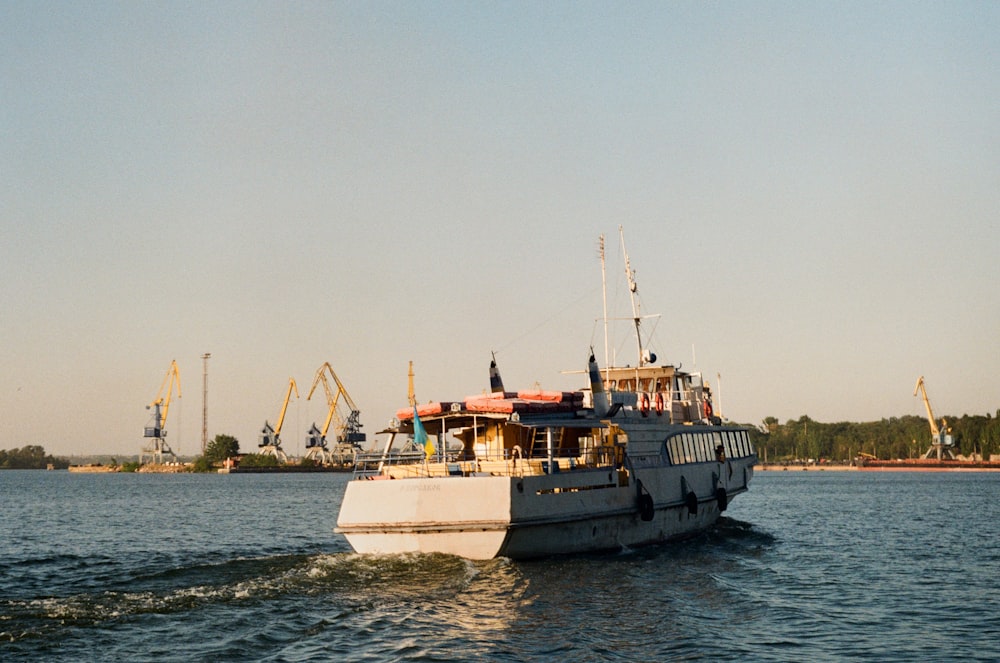 white and black boat on sea during daytime