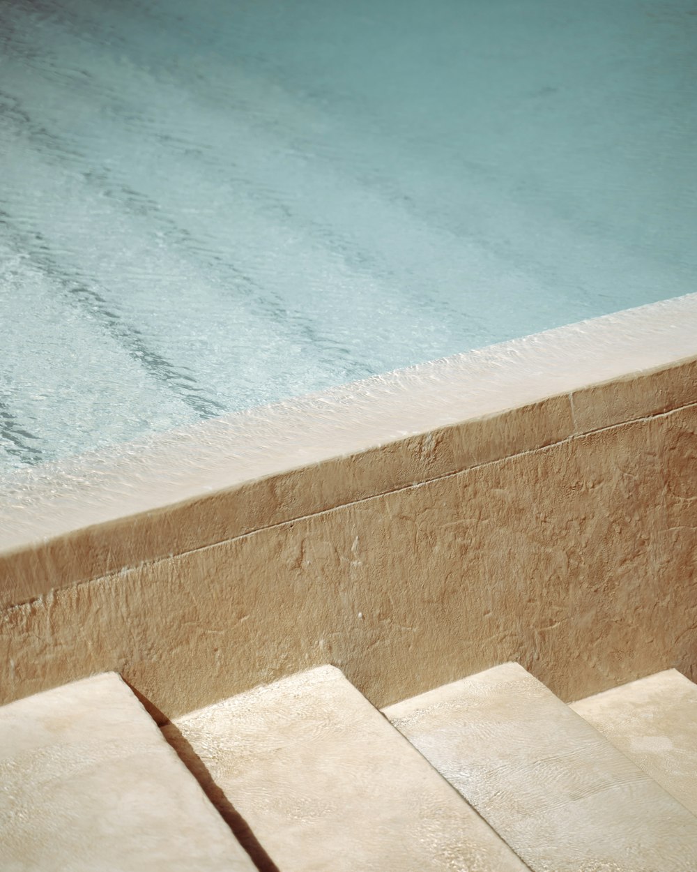 blue swimming pool during daytime