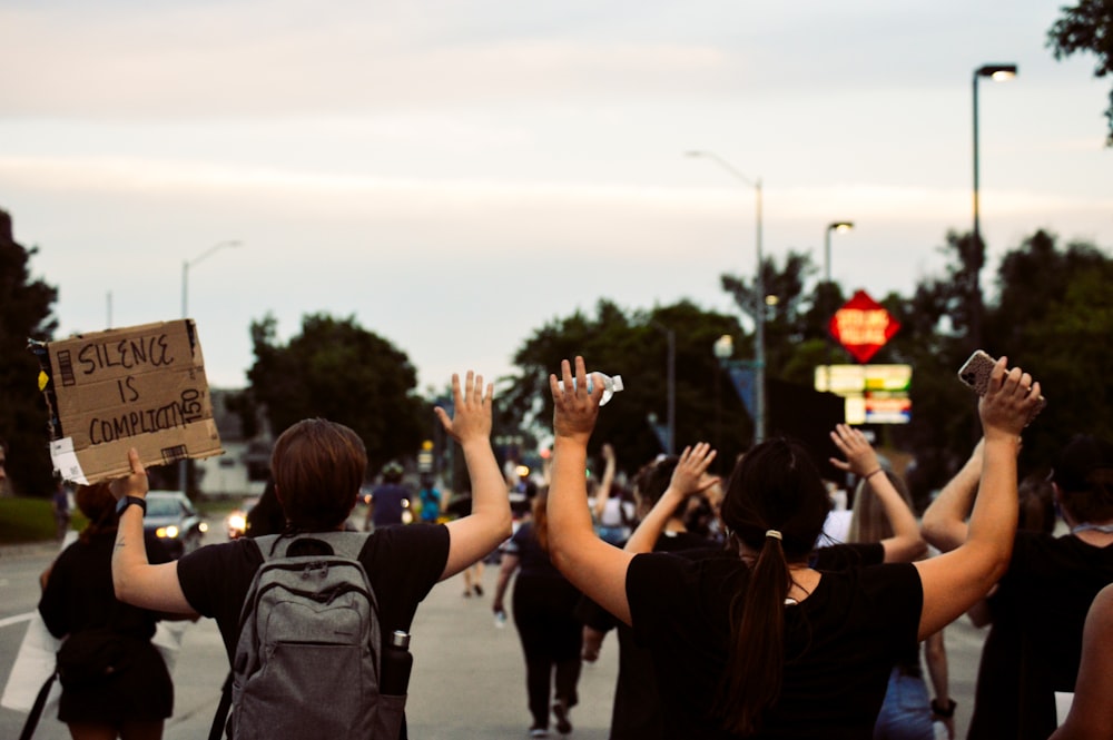 people standing on gray concrete pavement during daytime