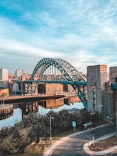 brown bridge over body of water during daytime