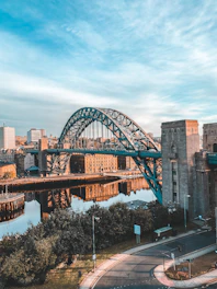 brown bridge over body of water during daytime