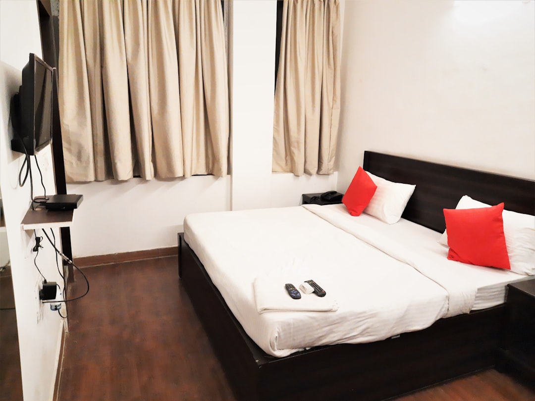 white bed with white bed linen,