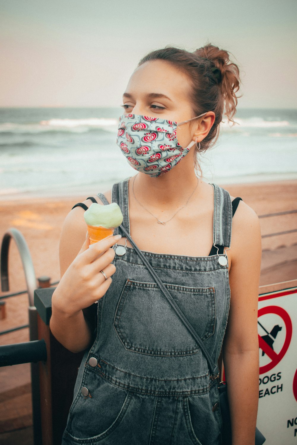 woman in gray tank top holding ice cream cone