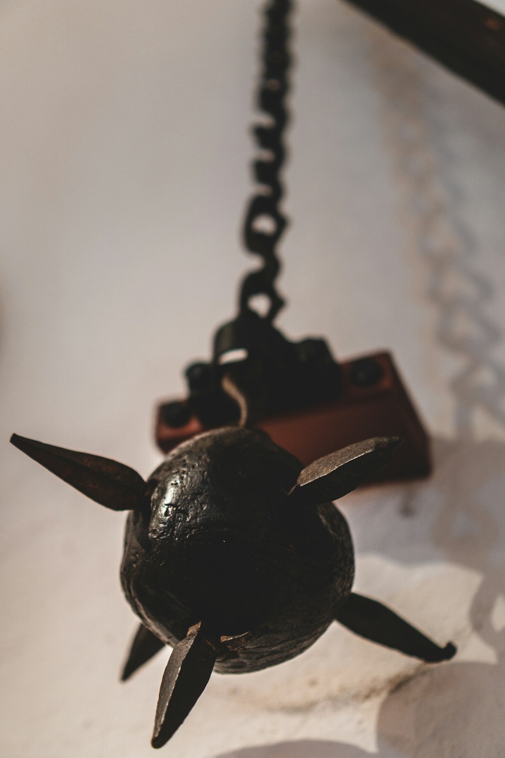 black dragon pendant on white textile