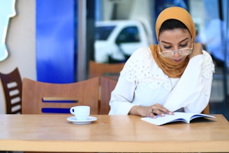 woman in white long sleeve shirt using white tablet computer