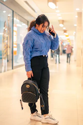 Friendly customer support agent assisting a shopper via headset.