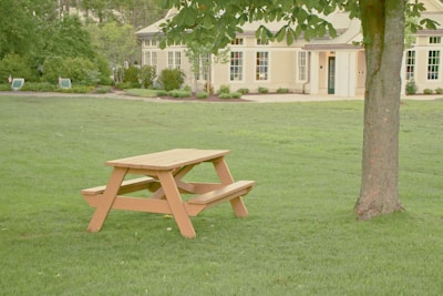 Close-up of stylish picnic tables arranged elegantly on a grassy lawn