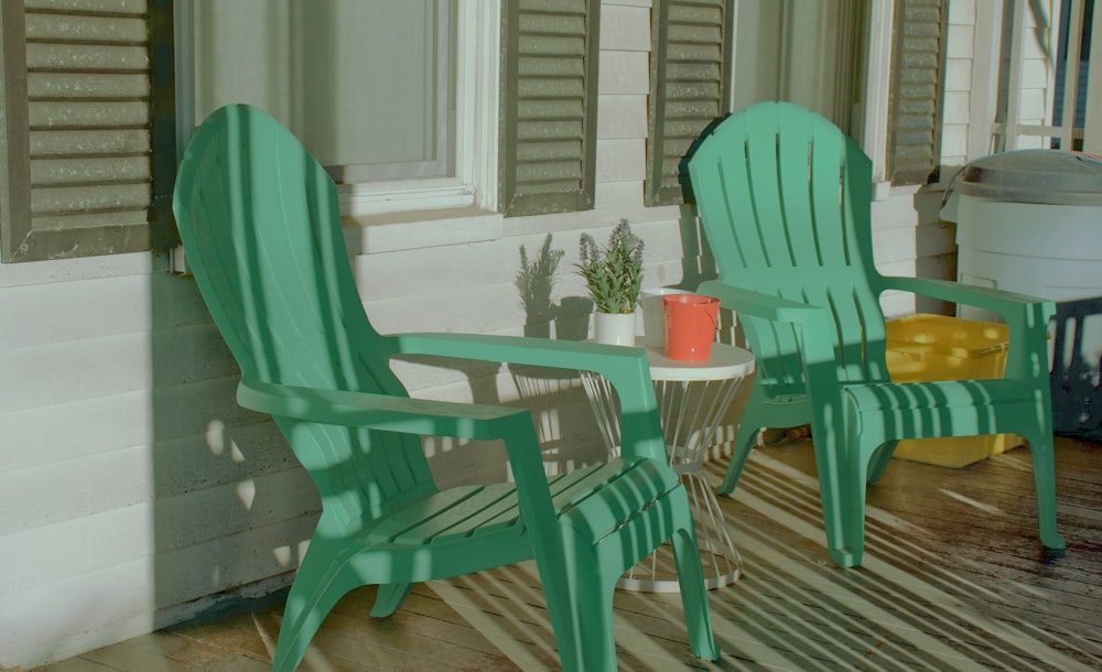 blue wooden armchair beside green potted plant