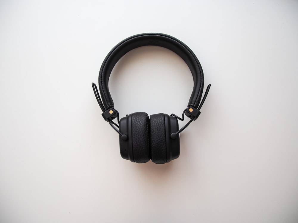 black headphones on white table