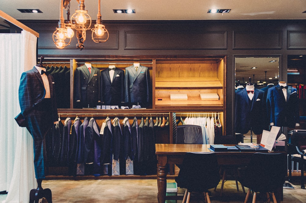 black suit jacket on brown wooden chair