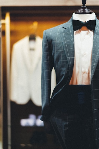Suit fabric swatches in navy, charcoal, and grey wool