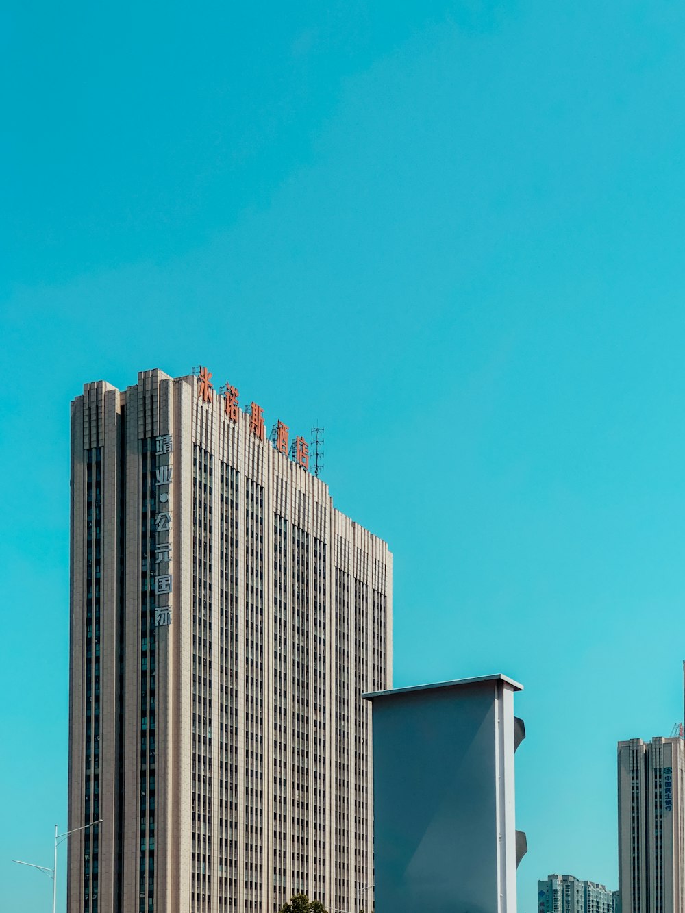 white and brown concrete building under blue sky during daytime