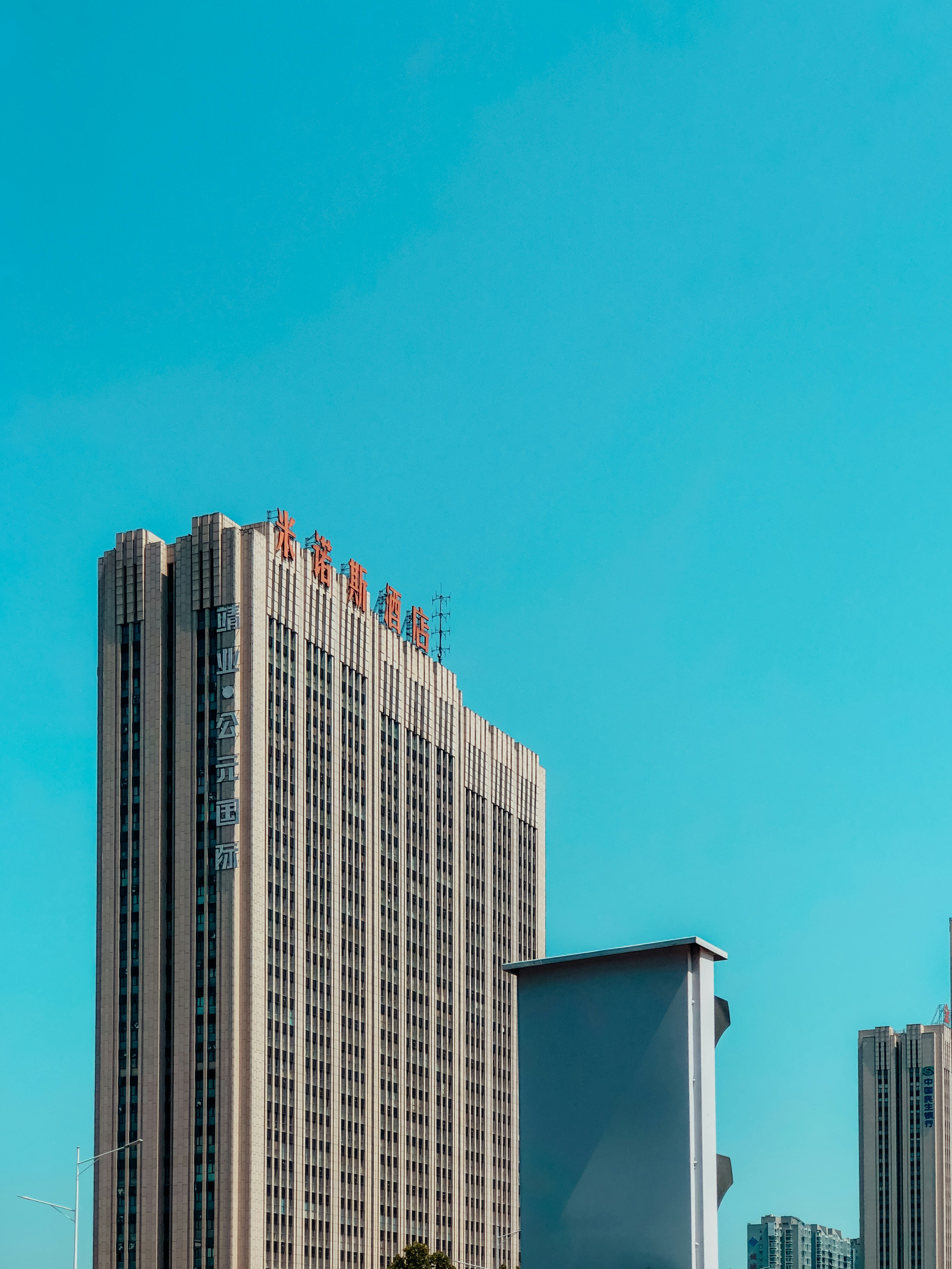 white and brown concrete building under blue sky during daytime