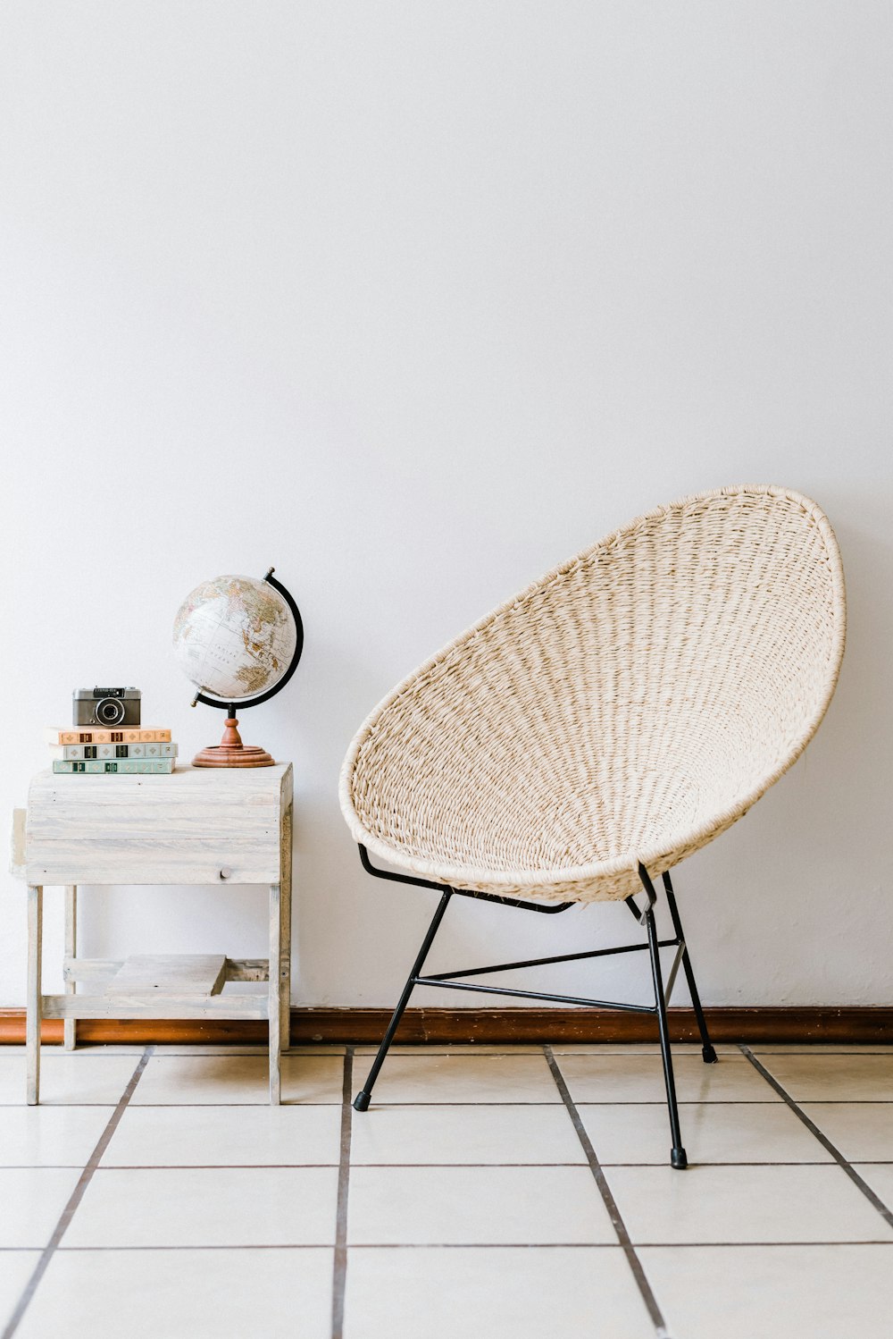 white and black chair beside white table