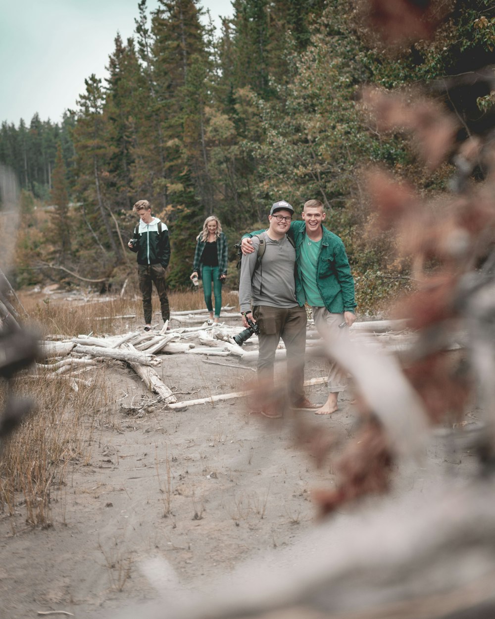 people walking on dirt road during daytime