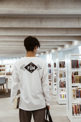 Happy library visitor returning a book using prestapresto system