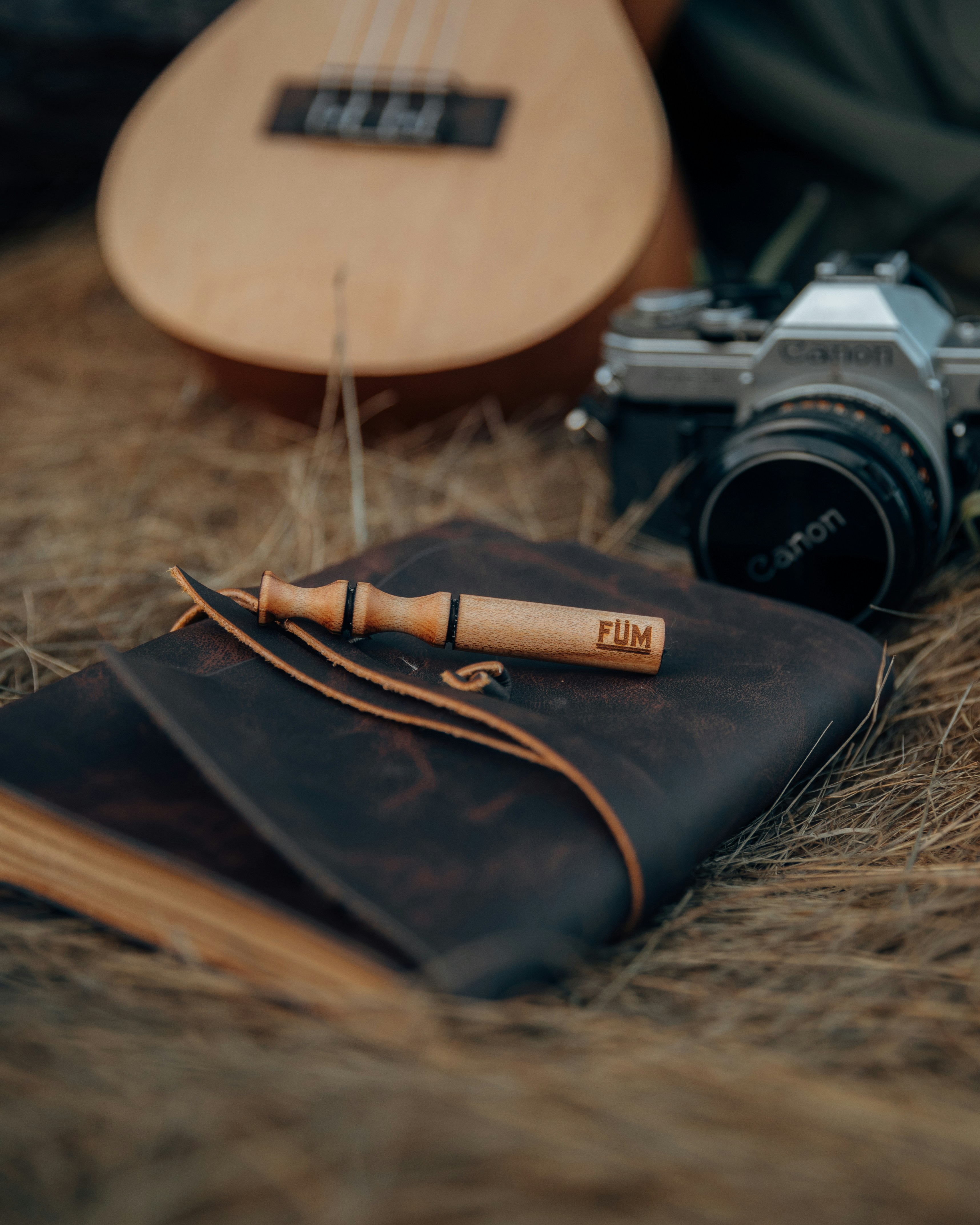 a camera and a book on the ground
