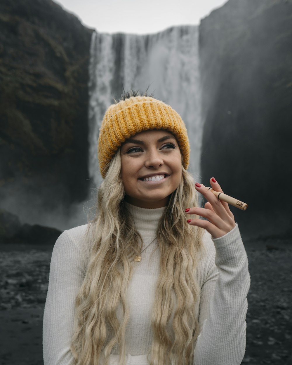 woman in beige knit cap and white long sleeve shirt