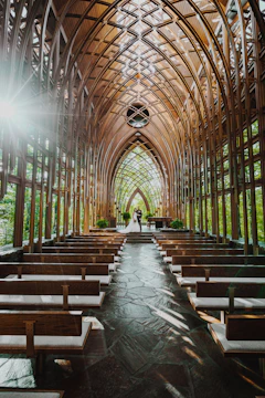 A serene holy matrimony ceremony captured with warm tones and natural light inside a beautiful chapel.