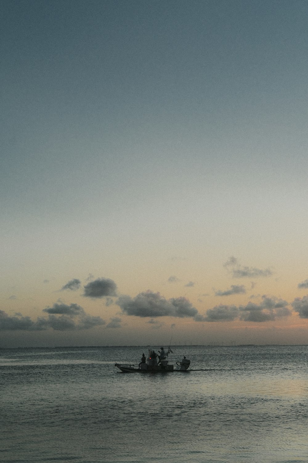 body of water under cloudy sky during daytime