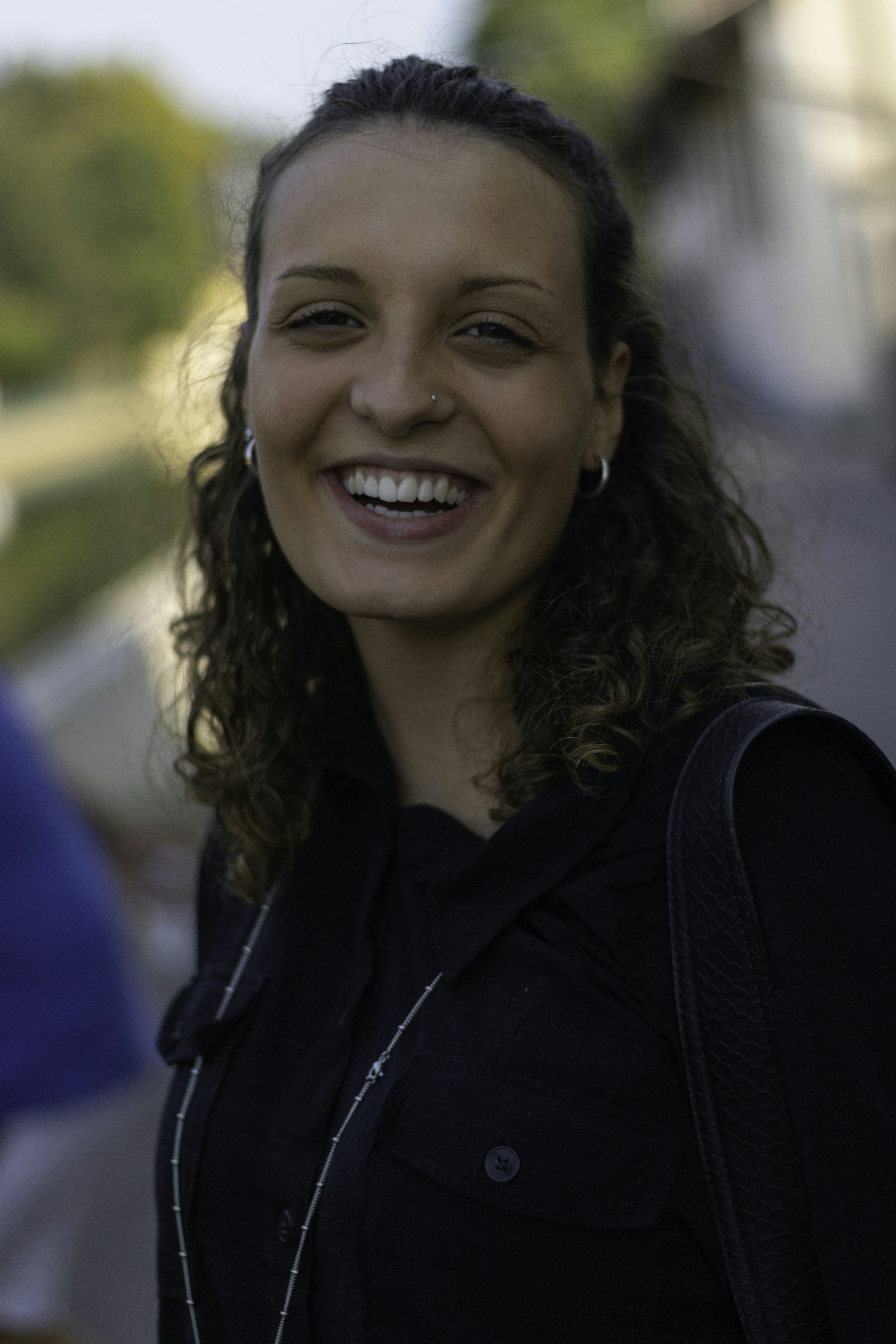 smiling woman in black shirt
