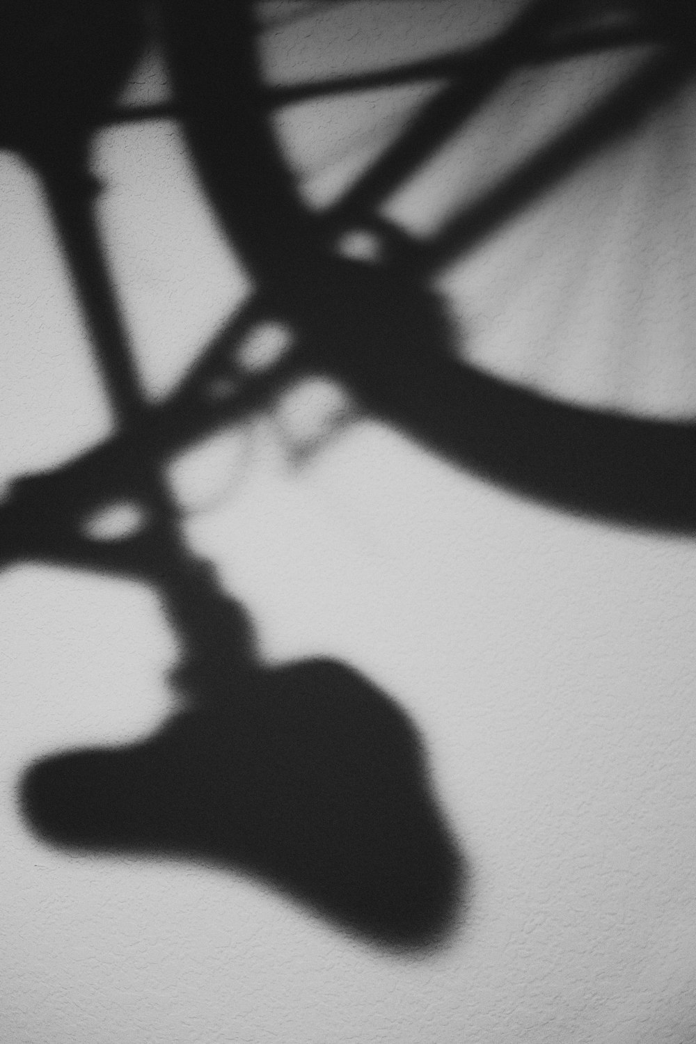 silhouette of person riding bicycle