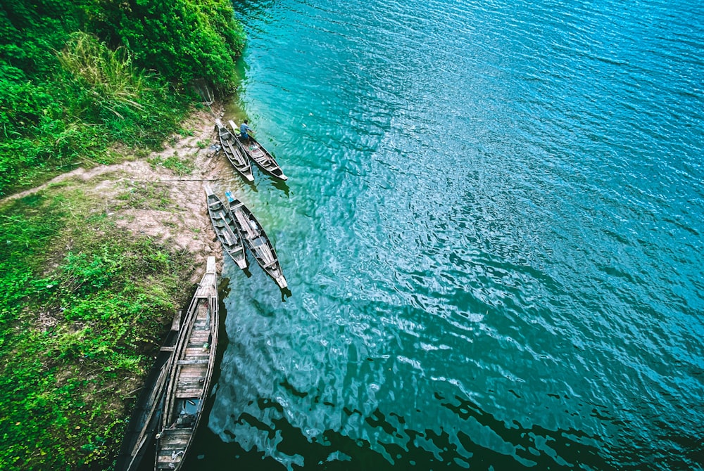 white boat on body of water during daytime