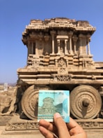 person holding blue and white book