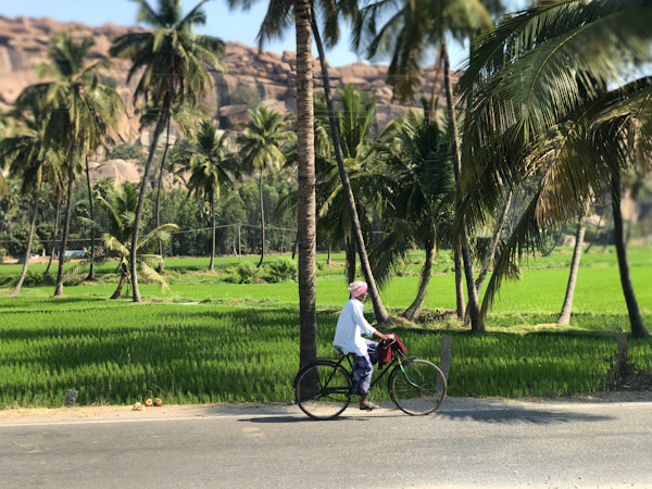 A man cycling along a city road