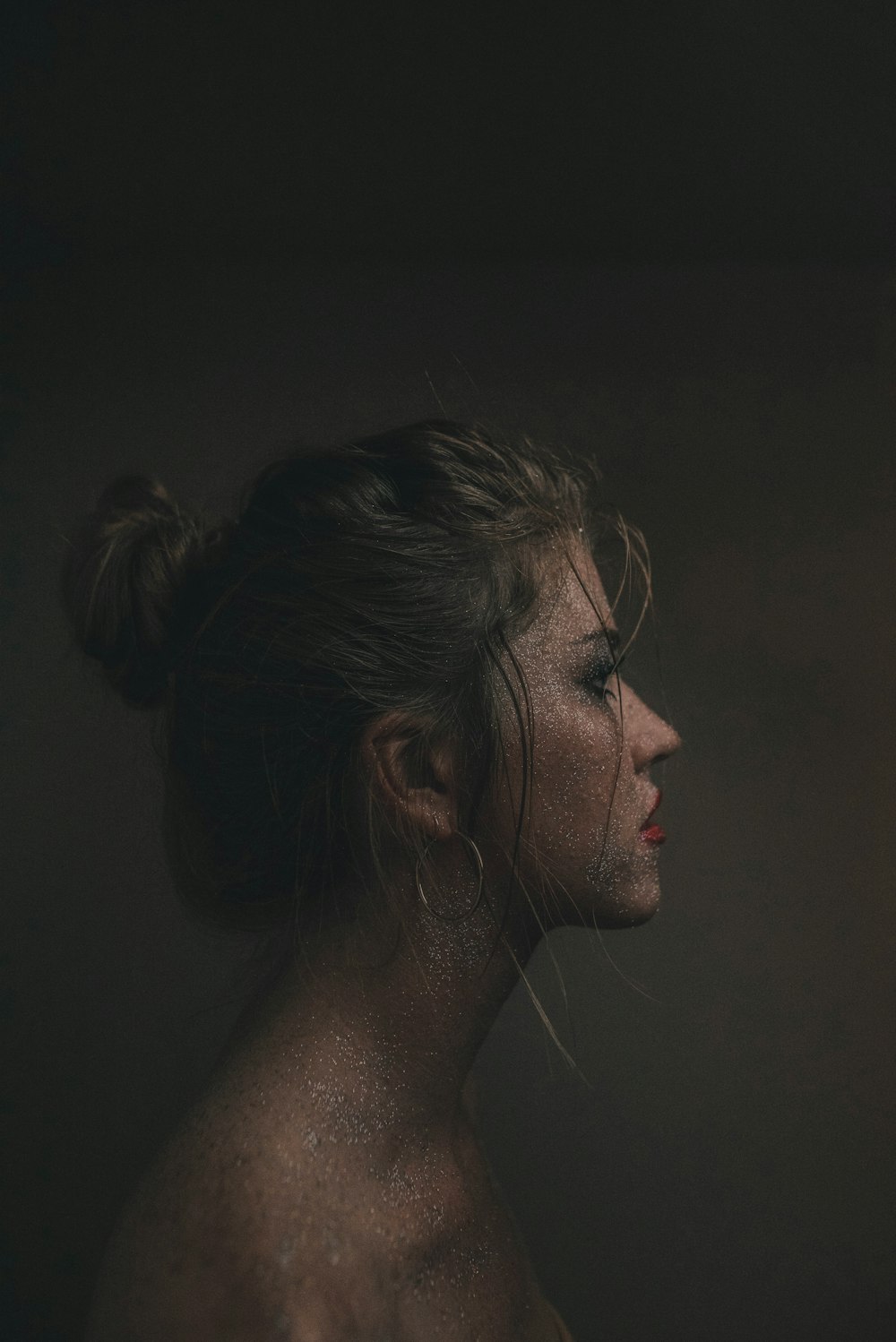 woman with silver earrings and silver earrings