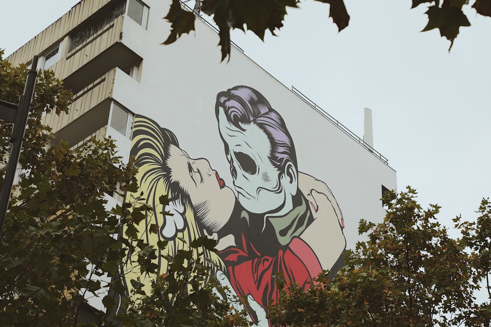 womans face graffiti on white concrete building