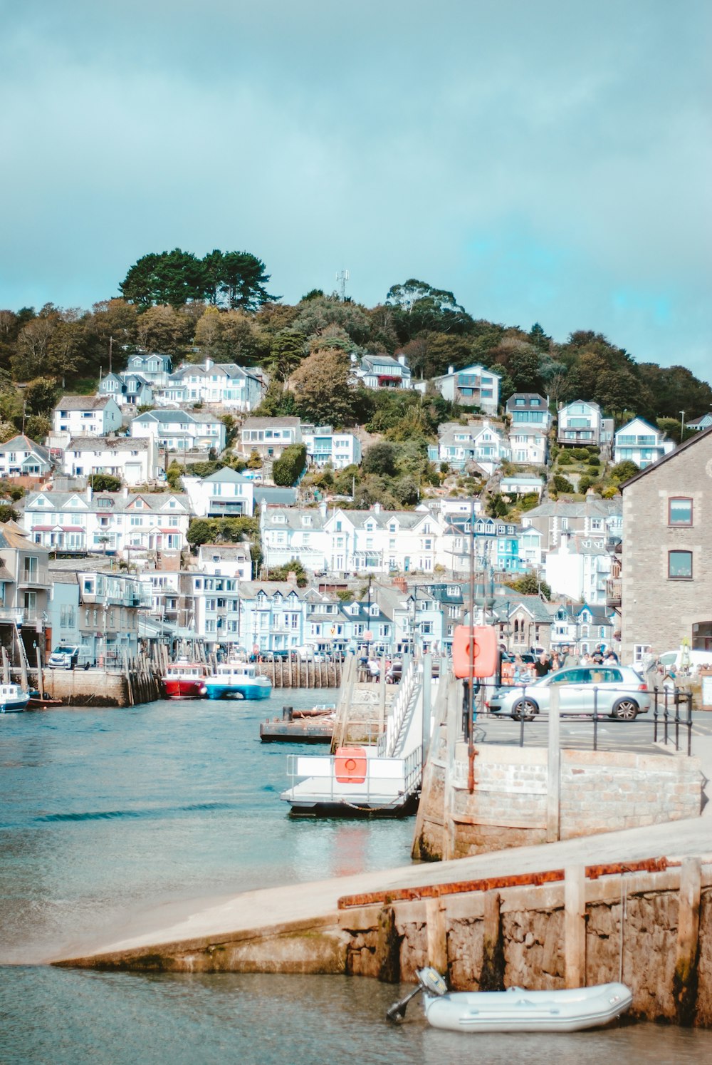 boat on the sea near buildings during daytime