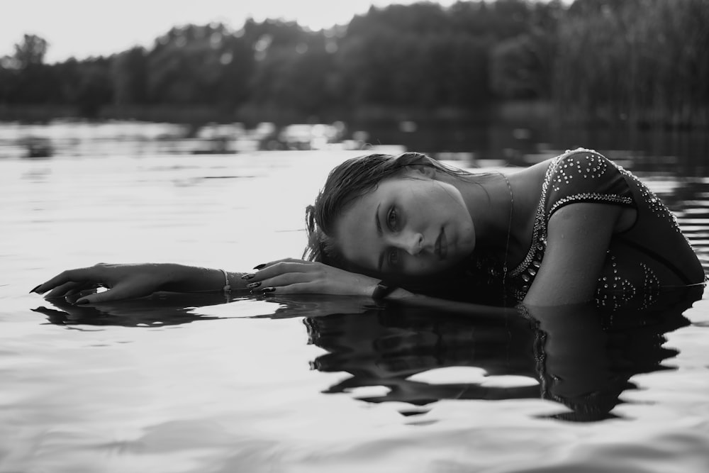 grayscale photo of girl in water