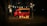 A vintage red food truck is parked in a dimly lit outdoor setting. Large illuminated letters spelling 'vr&w' are placed in front of the truck. String lights are hanging above, casting a warm glow. The environment appears to be a wooded area at night, contributing to a cozy atmosphere.