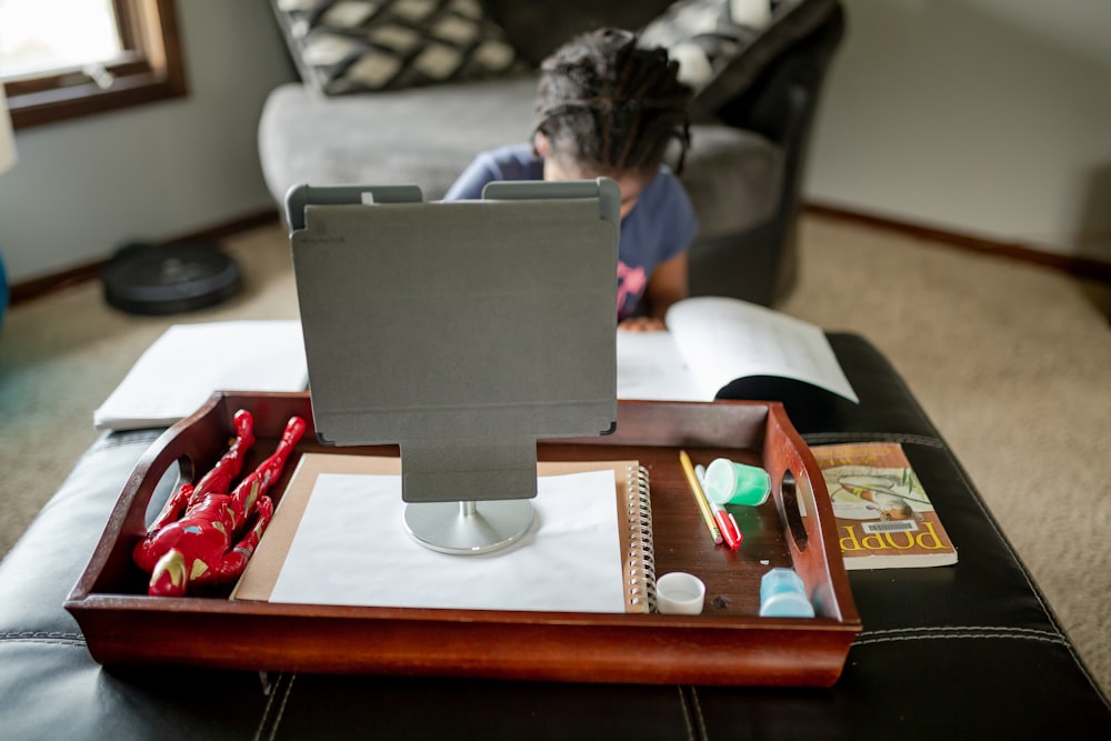 black flat screen computer monitor on brown wooden table