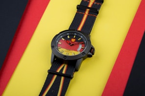 A stunning black and yellow Invicta watch showcasing its classic colors.