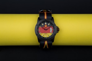 A sporty watch featuring a chronograph and vibrant colors.
