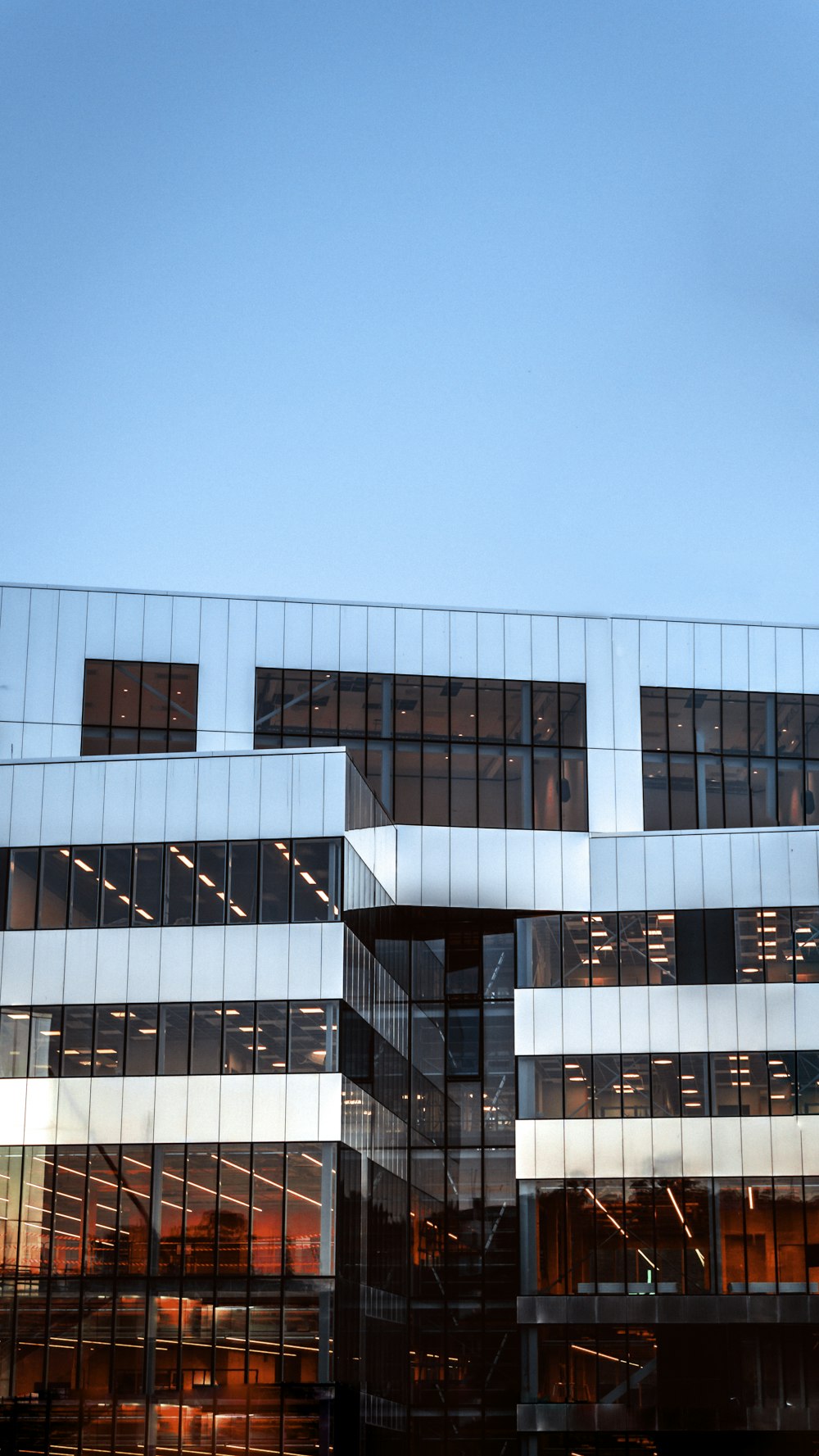 blue and white concrete building under blue sky during daytime