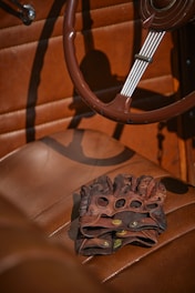 brown wooden chair with brown leather pad