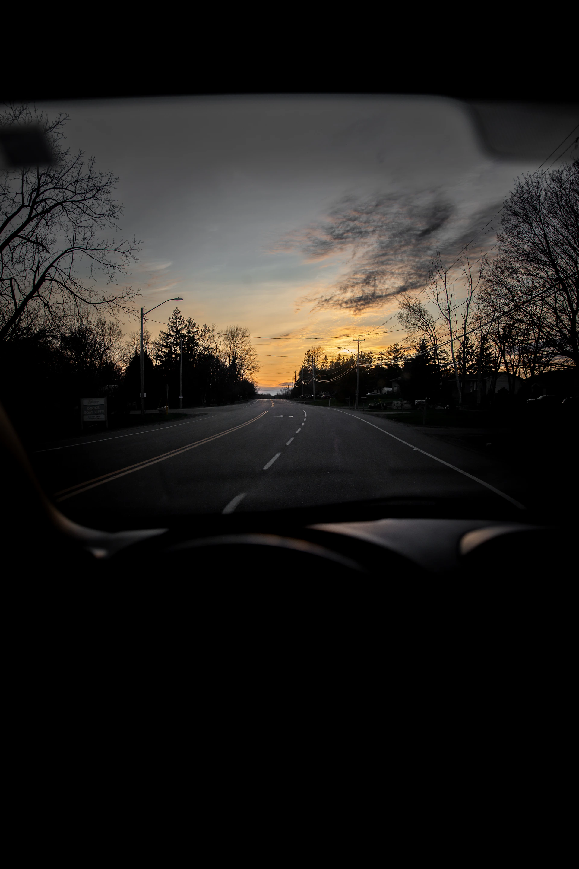 car on road during sunset