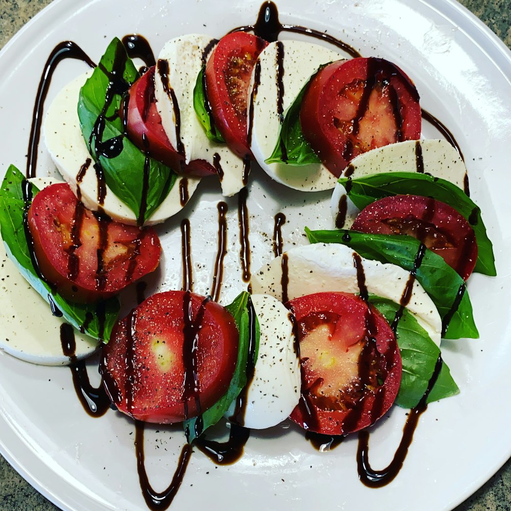 sliced tomato on white ceramic plate