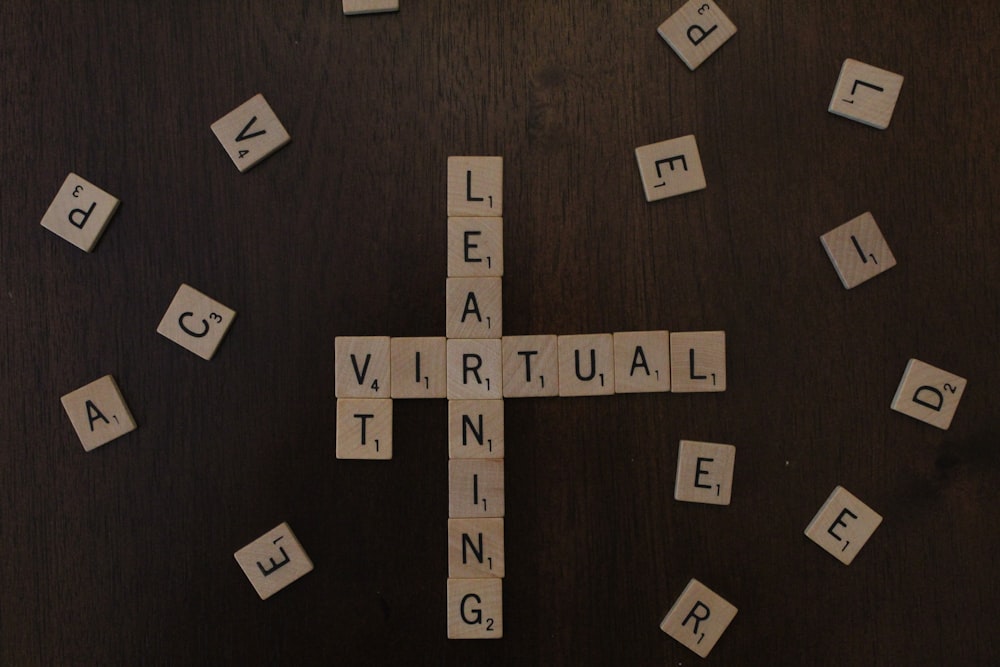 black and white letter blocks on brown wooden table