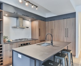 white wooden kitchen cabinet with stainless steel faucet