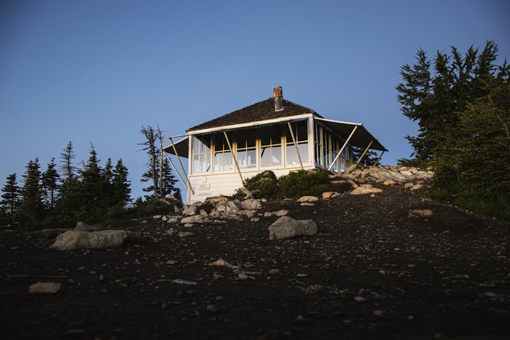 white and brown wooden house under blue sky during daytime