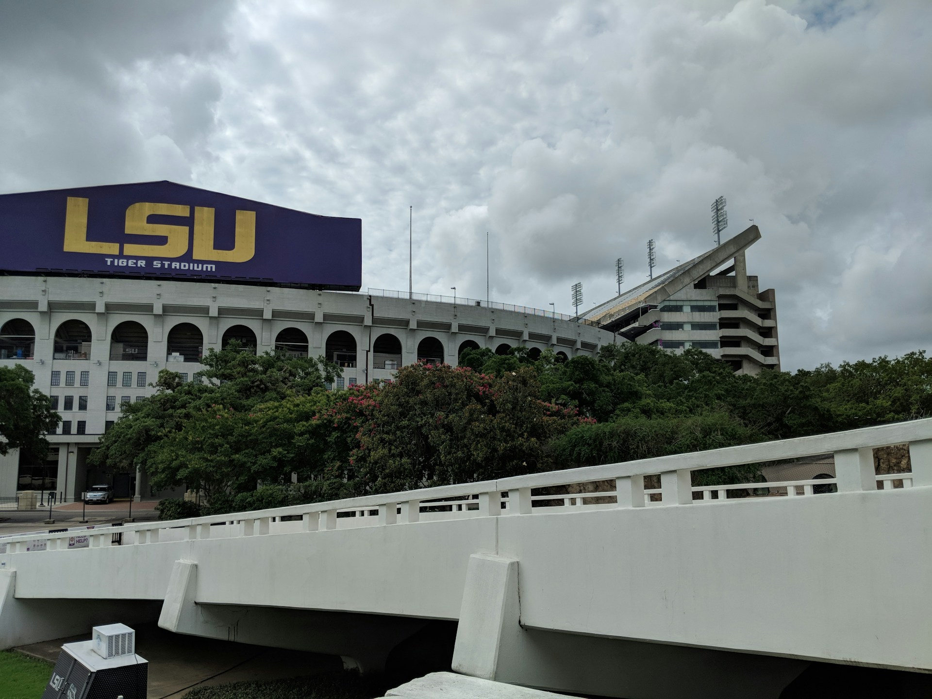 woman wearing yellow long-sleeved dress under white clouds and blue sky during daytime