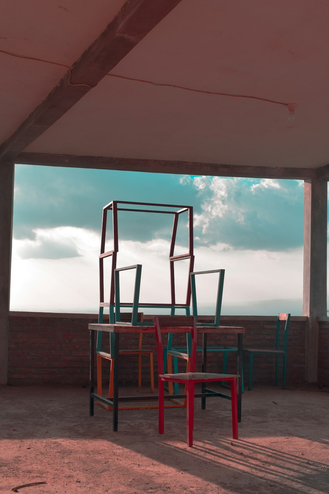 brown wooden chairs on beach during daytime